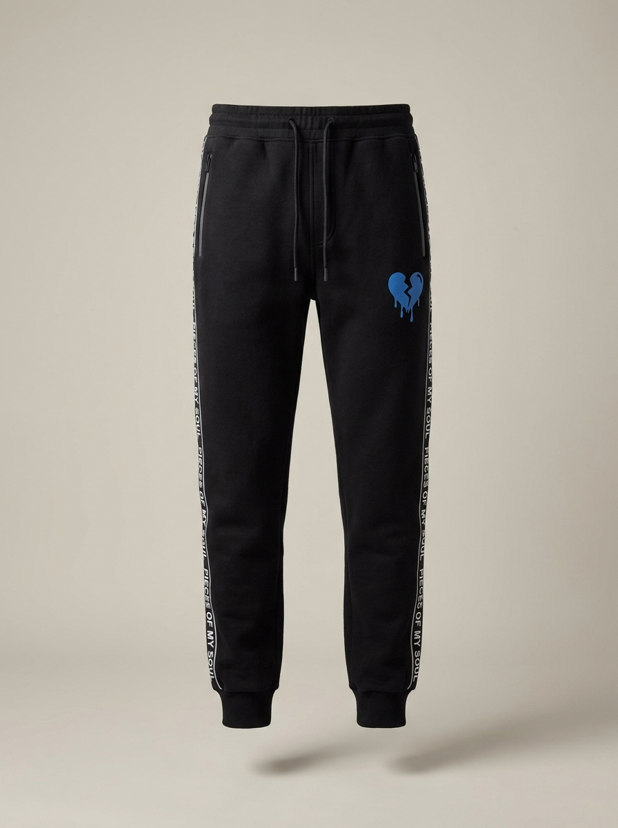 Black POMS joggers with blue broken heart, front view