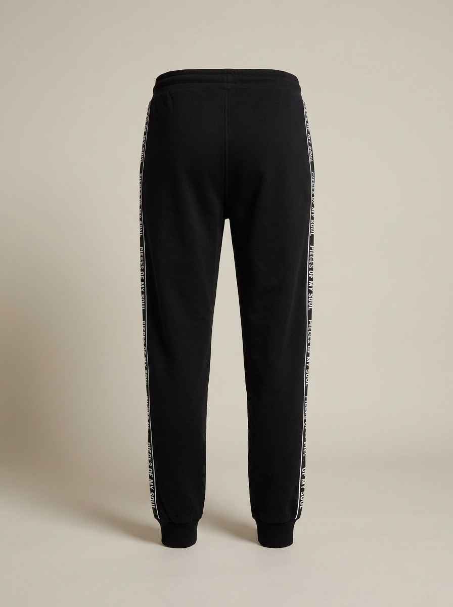 Black POMS joggers, back view red heart